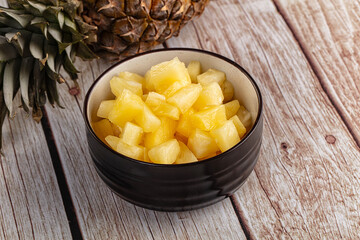 Sweet canned pineapple fruit pieces