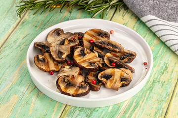 Tasty hot grilled champignon mushrooms