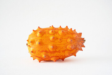 Close-up of a kiwano, African horned cucumber, exotic orange-yellow fruit