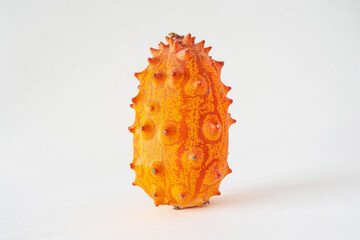 Close-up of a kiwano, African horned cucumber, exotic orange-yellow fruit