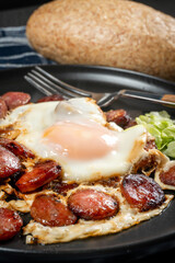 Fried egg and sliced sausage.