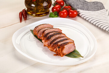 Sliced duck breast baked with cherry