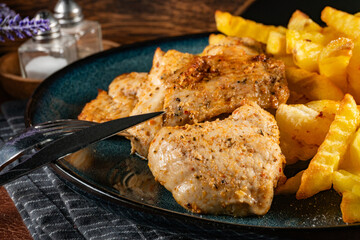 French fries with chicken pieces.