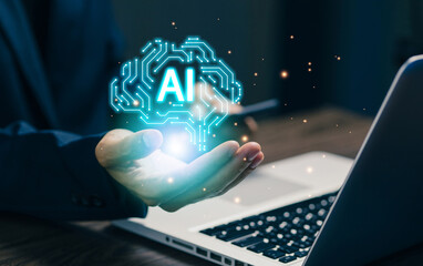 A glowing AI brain hologram above a hand near a laptop, representing artificial intelligence, machine learning, digital innovation, smart technology, and future-driven business solutions.