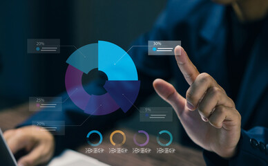 A business professional points at a digital pie chart interface, representing data analysis, performance breakdown, business intelligence, financial reporting, and strategic decision-making.