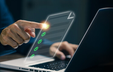 A finger selects items on a digital checklist interface above a laptop, representing task completion, approval process, quality control, workflow management, and efficient business operations.
