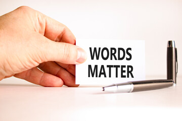 Words matter symbol. Concept word Words matter on beautiful white card. Beautiful black pen. Beautiful white paper background. Businessman's hand. Business words matter concept. Copy space.