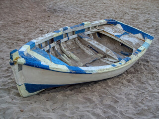 old boat abandoned on the beach
