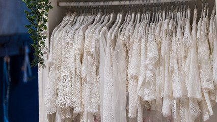 Close up view of elegant wedding dresses displayed in a bridal fashion boutique showcasing timeless bridal style and luxury design