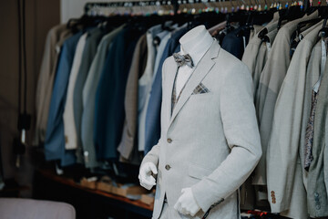 Stylish mannequin dressed in a classic wedding suit inside a bridal boutique highlighting premium menswear and formal fashion design