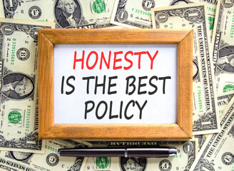 Honesty is the best policy symbol. Concept words Honesty is the best policy on beautiful wooden picture frame. Beautiful dollar bills background. Business honesty is best policy concept. Copy space.