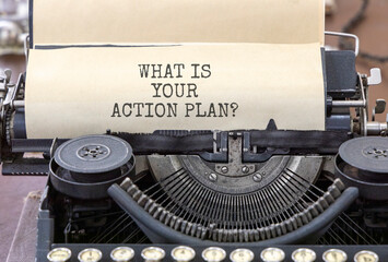 What is your action plan symbol. Concept words What is your action plan typed on beautiful old retro typewriter. Beautiful white paper background. Business what is your action plan concept. Copy space
