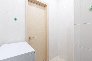 modern bathroom room with toilet and washing machine