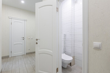 modern bathroom room with toilet and washing machine