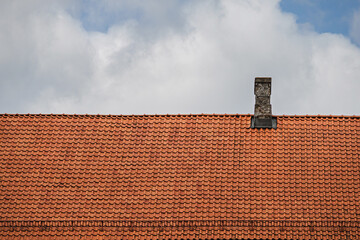 Orange clay tile roof. The roof of the building is made of clay tiles