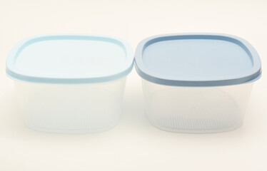 Large containers for food. Three plastic containers with a blue lid for food on a white background.