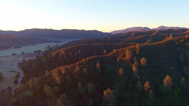 This stunning aerial view captures the volcanic rock spires and peaks of Pinnacles National Park at sunrise