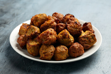 Indian Style Snack Selection with onion bhajis and pakoras