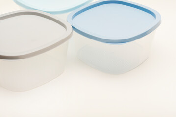 Large containers for food. Three plastic containers with a blue lid for food on a white background.