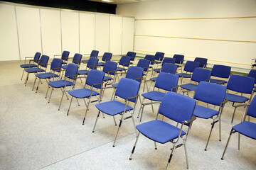 A large empty boardroom with empty chairs