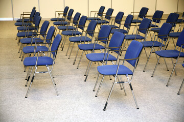 A large empty boardroom with empty chairs