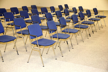 A large empty boardroom with empty chairs