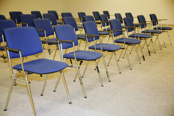 A large empty boardroom with empty chairs