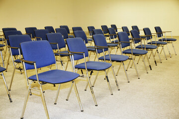 A large empty boardroom with empty chairs