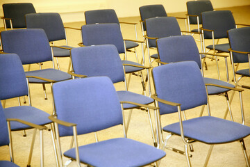 A large empty boardroom with empty chairs