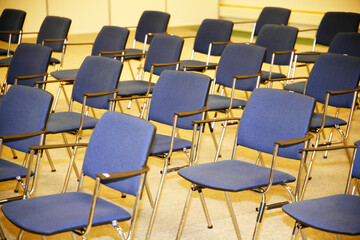 A large empty boardroom with empty chairs
