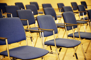 A large empty boardroom with empty chairs