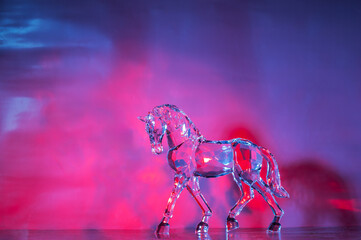 Crystal horse on gradient background.