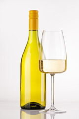 White wine bottle and glass on white background