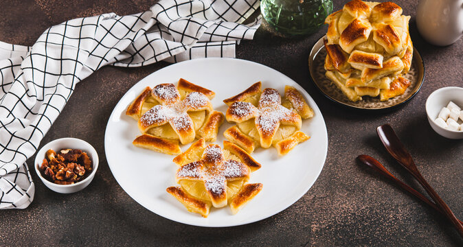 Sweet puff pastries with pineapple in powdered sugar on the table web banner