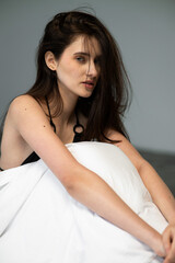 Natural emotional portrait of young woman model with expressive face, authentic beauty, lifestyle mood, clean skin, real emotions, modern female portrait photography in studio