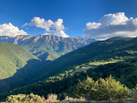 Pyrenees mountains landscape with green valleys and cloudy sky