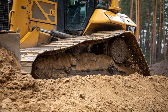 Crawler dozer, backhoe loader, articulated dump trucks and excavator on a construction site. Construction equipment. Heavy machines. Construction site.