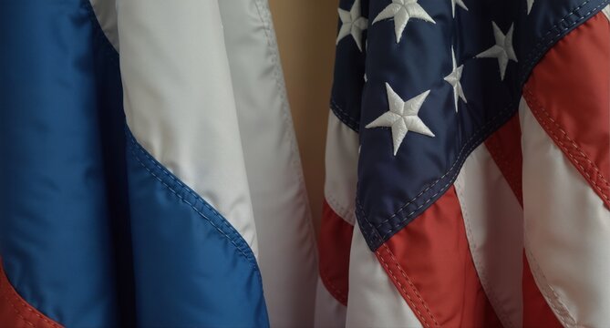 close-up of a waving american flag with detailed stitching and vibrant colors, representing patriotism and national pride. - Powered by Adobe