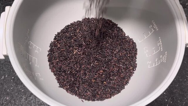 Pour in the riceberry rice to prepare for cooking.