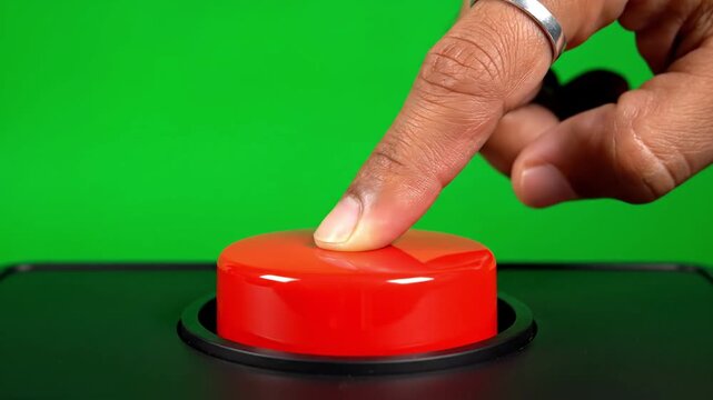 Close up of hand pressing large red button on green screen background