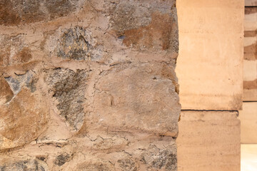 close up view of assorted stone textures in warm tones. abstract textured background with beige stone surface. variety of natural