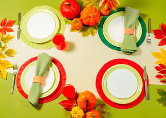 a table with a plate fork and napkin