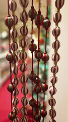 Festive christmas and new year decorations with hanging ornaments for holiday ambiance. Vertical banner. Copy space