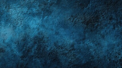 Fototapeta premium A deep blue surface shows various textures and patterns. The light enhances the contrast creating an interesting backdrop for creative projects and designs.