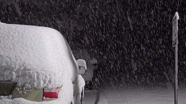 Snow falling on parked cars early morning snowfall winter weather storm warning quiet peaceful news station reel high quality B-roll 4k 60 fps Video North East USA