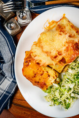 Stuffed pancake baked with cheese.
