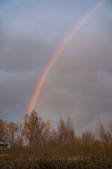 rainbow in the evening sky in autumn, a natural phenomenon
