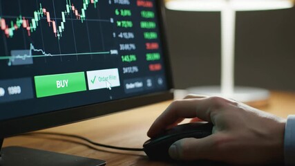 Stock market trader clicking buy button on trading interface. Close-up of hand using mouse to execute financial order on computer screen. Investment and business concept - Powered by Adobe