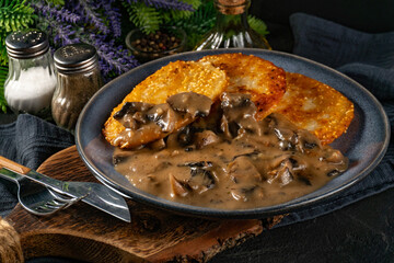 Crispy potato pancakes with mushroom sauce