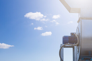 Batch of industrial exhaust snail fans with installed electric motors for air ventilation in a factory open-air warehouse storage area awaiting transportation. © Torkhov